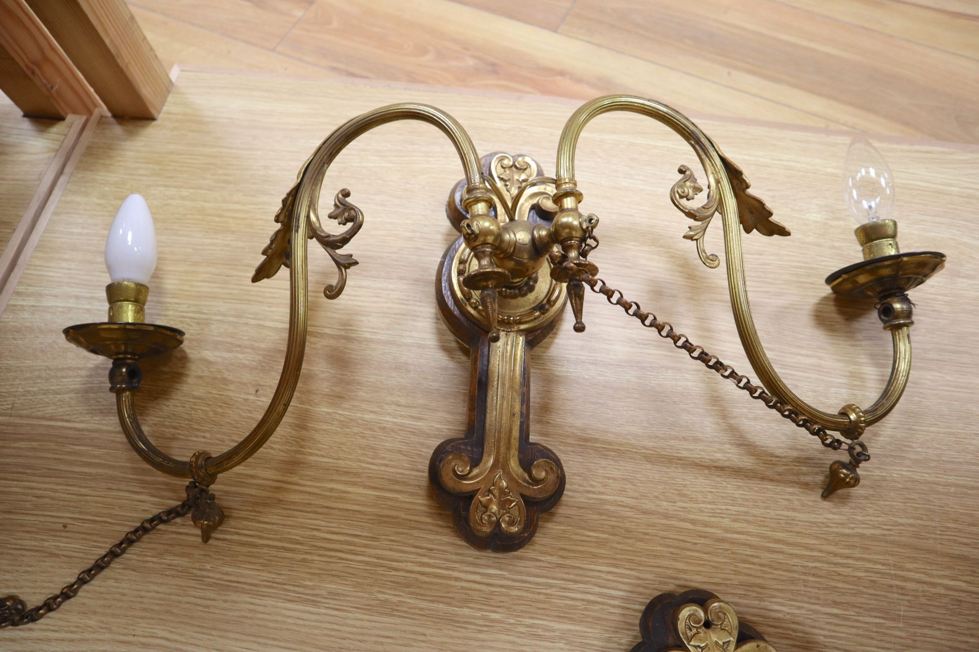 A pair of ormolu wall lights, width 65cm